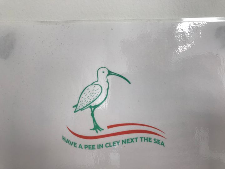 A sign saying "have a pee in Cley Next The Sea"